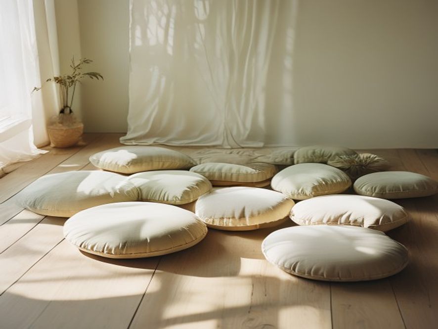 Group sitting in peaceful circle formation in light-filled room